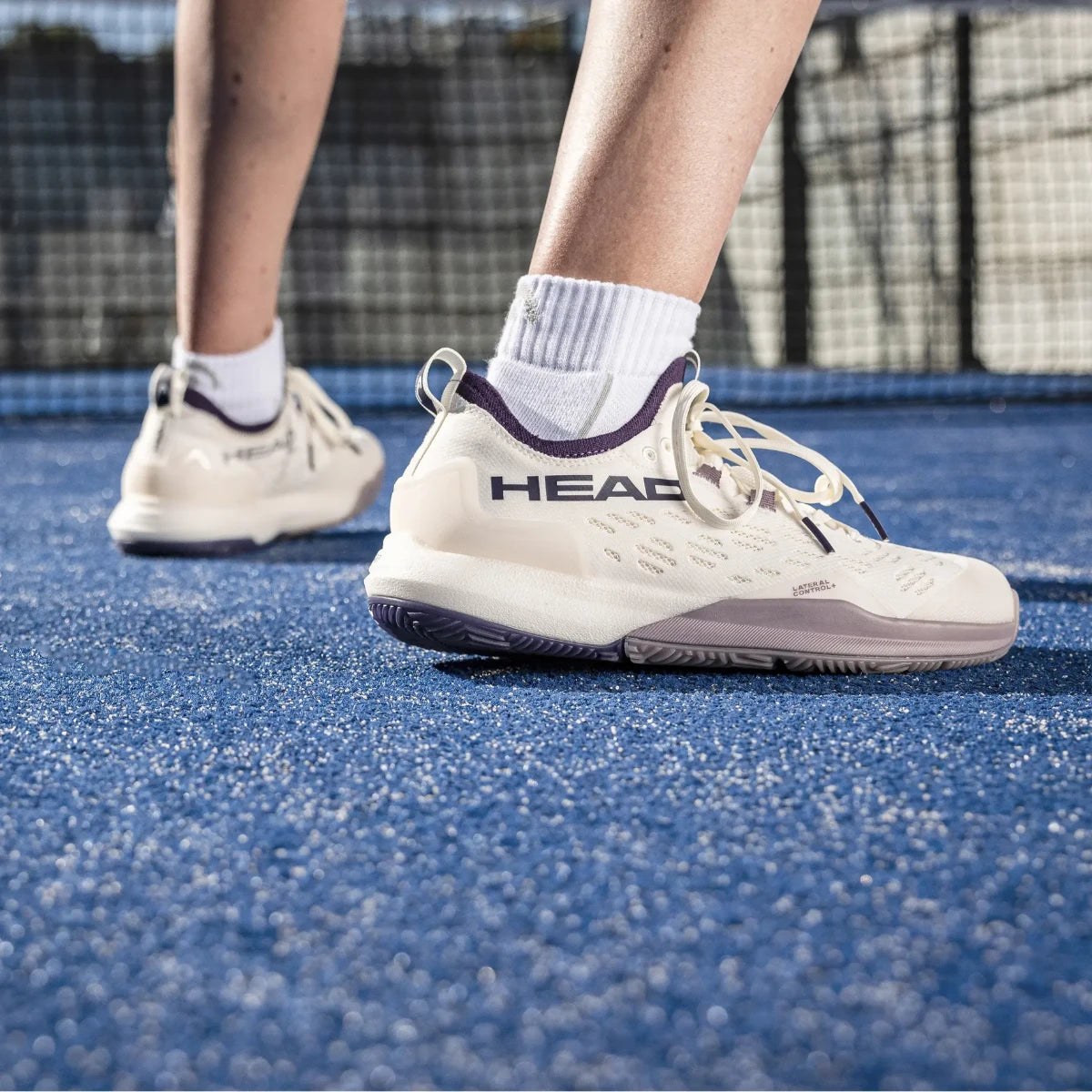 Head Motion Pro 1.5 women's padel shoes worn on an artificial grass padel court