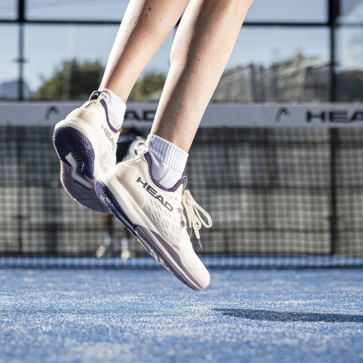 Player jumping in Head Motion Pro 1.5 women's padel shoes